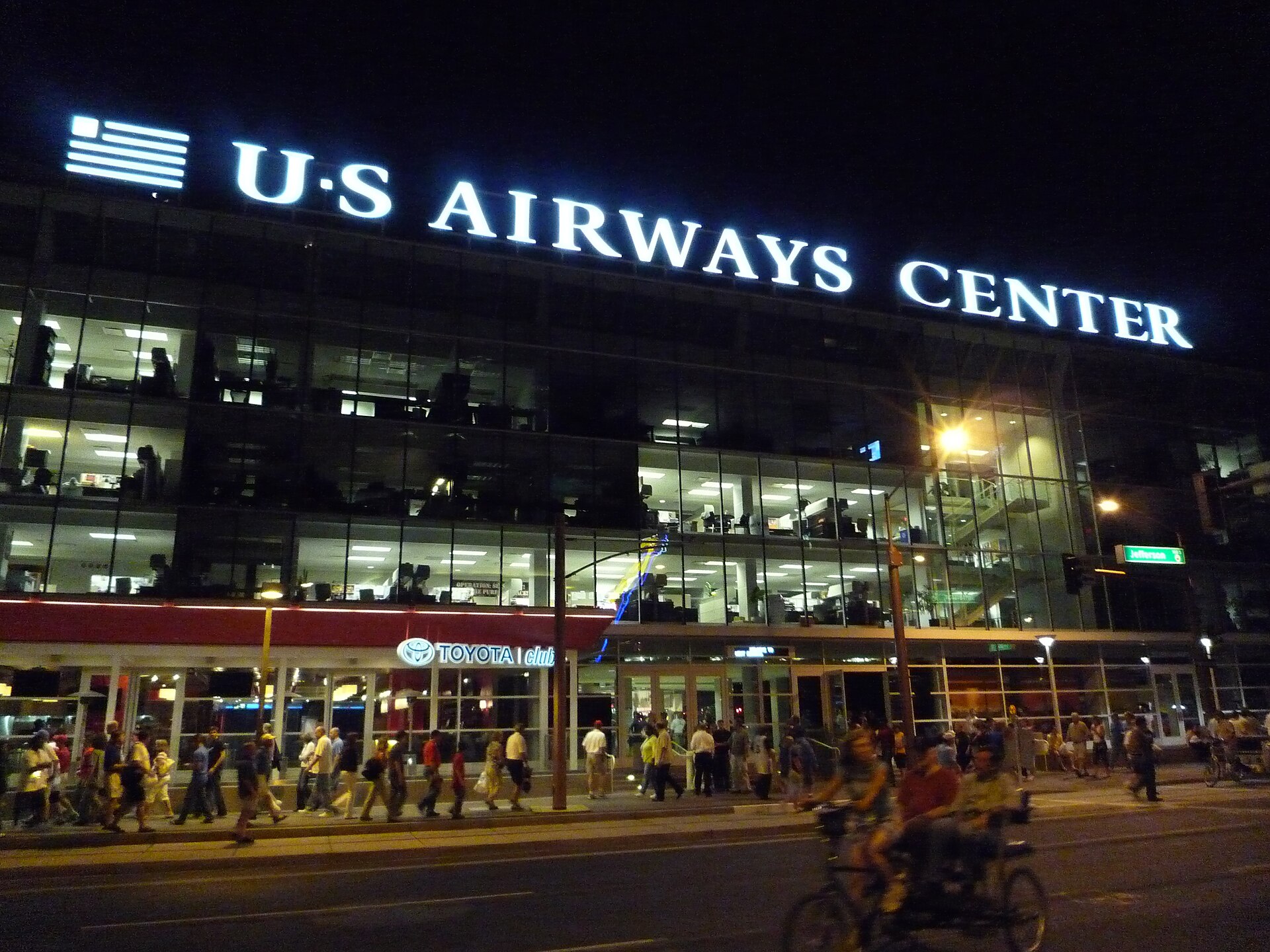 The downtown Phoenix arena now called Mortgage Matchup Center, formerly Footprint Center, lit up at night
