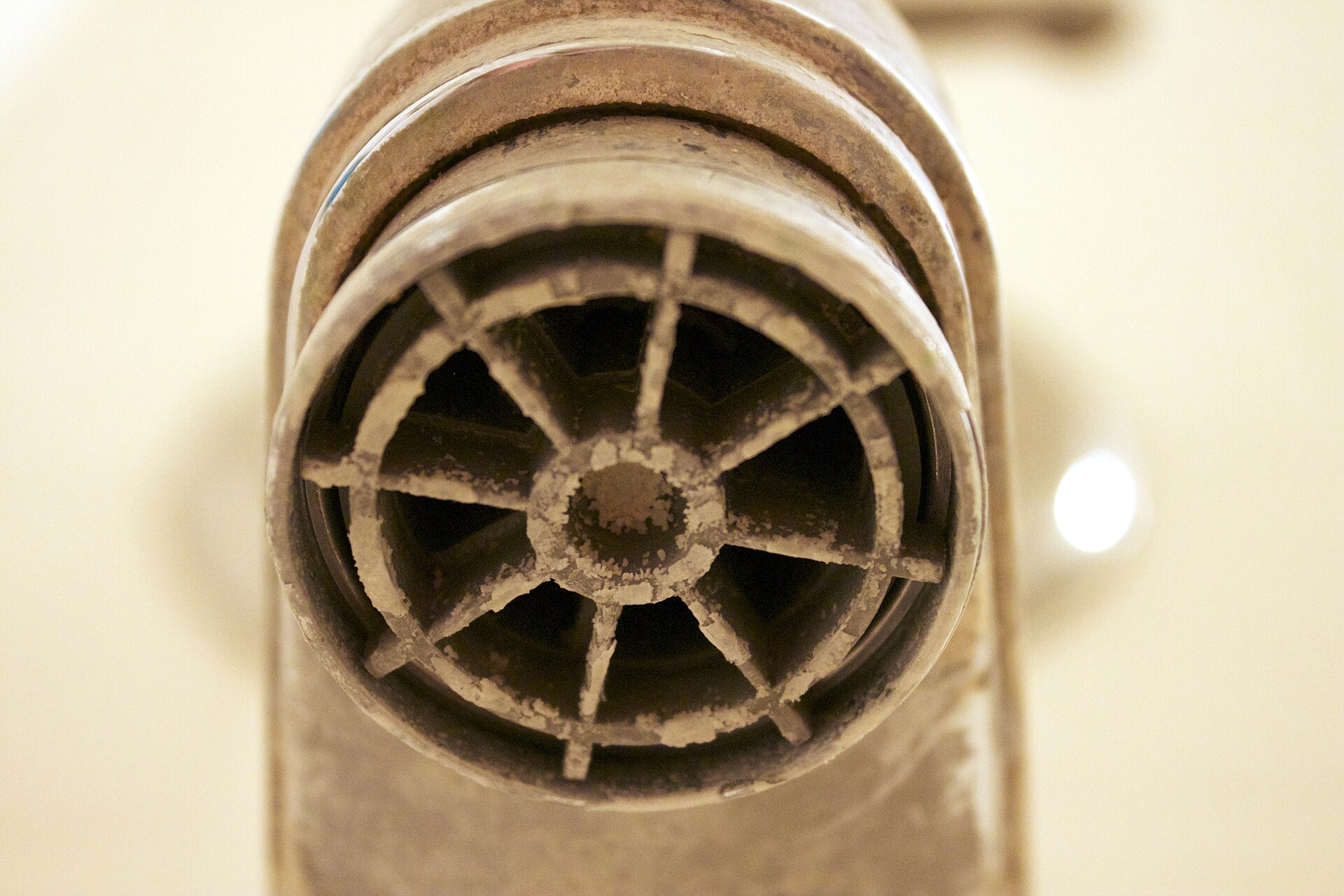Mineral scale from hard water built up inside a faucet fitting