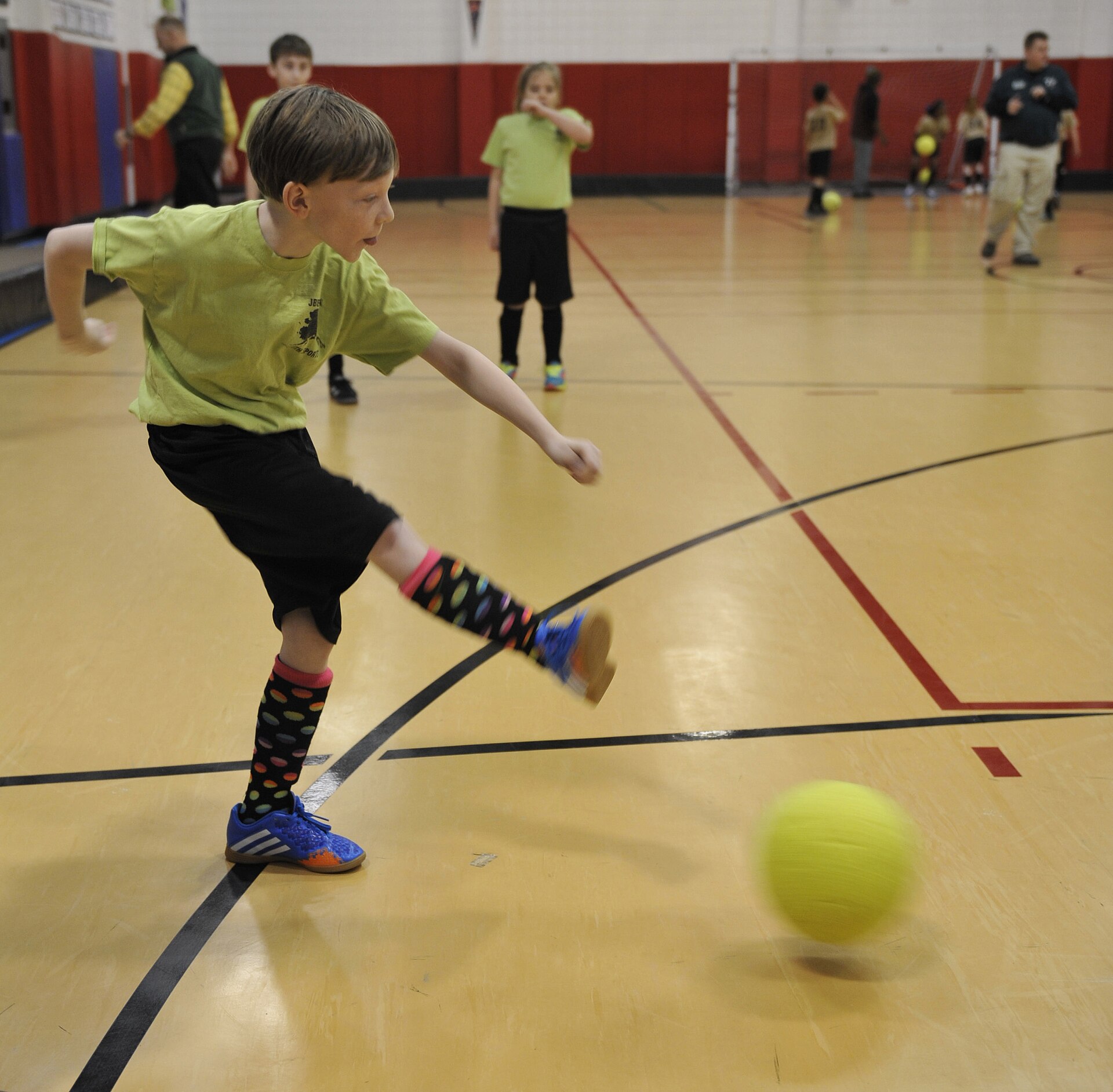 Youth soccer players in action during a tournament game